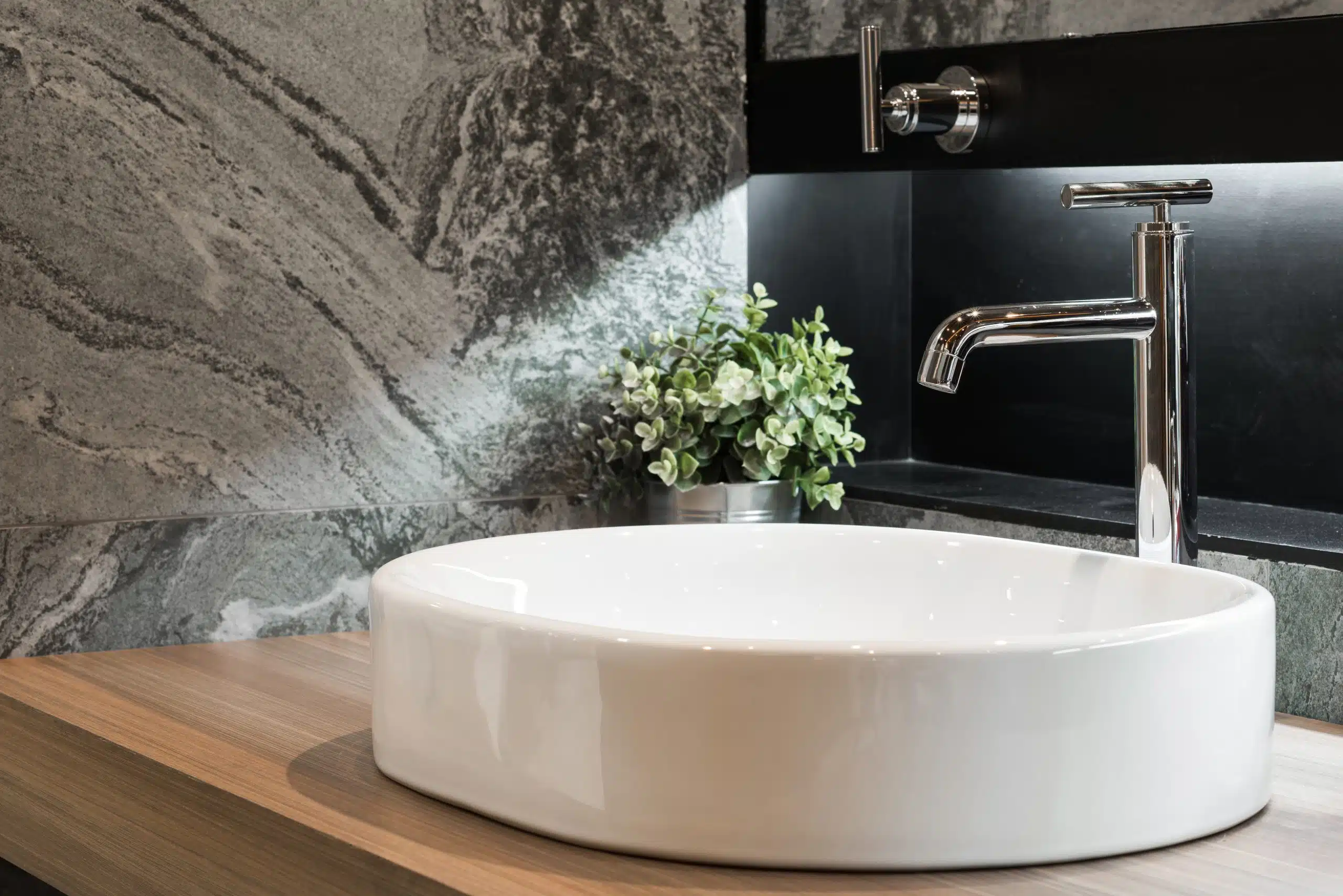 Bathroom interior with sink and faucet.