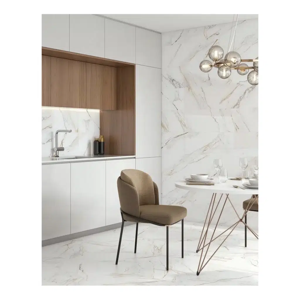 This Calacatta Paonazza effect wall tile has beautiful, gentle, veining with a high gloss finish on a 295x900mm durable white bodied ceramic tile. Taking inspiration from the famous marbles found in the Carrara region of Tuscany, Italy, this tile can be used to create luxurious walls throughout your home. The high Gloss finish adds a shine to the finish but does not distract from the classical timeless appearance. With high definition printing technology – HDinkjet printing technology and with different designs, these tiles look just like real marble with natural variance but being made from a high quality durable ceramic means they are hard wearing, long lasting, easy to clean and made affordable for everyone. The subtle warmth of veining means this can be combined with use of warmer tones around its use to harmonise and create a balanced look overall. Wood planks also tie in nicely with the look of using two natural materials together – wood and marble.